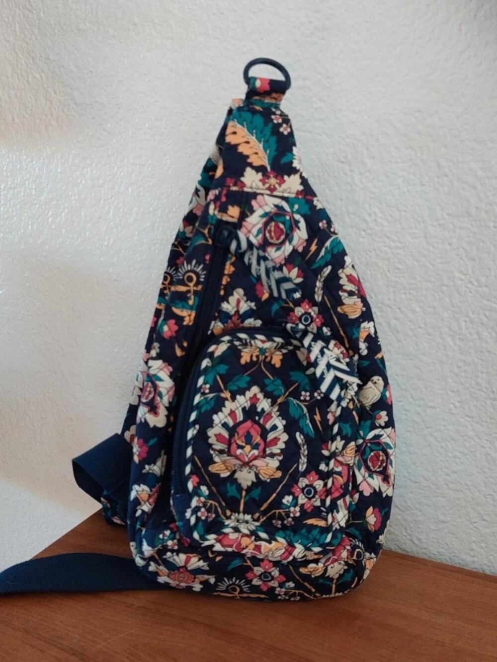 Vera Bradley Harry Potter Sling Backpack in the "Home to Hogwarts" pattern, feat